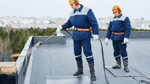 Crew performing emergency commercial roof repairs on an industrial building in guilderland, NY – commercial roof repairs near me