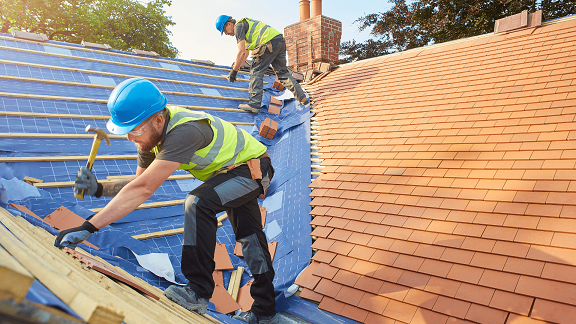 Experienced roofers in Albany, NY installing a new residential roofing system – Mastaba Roofing